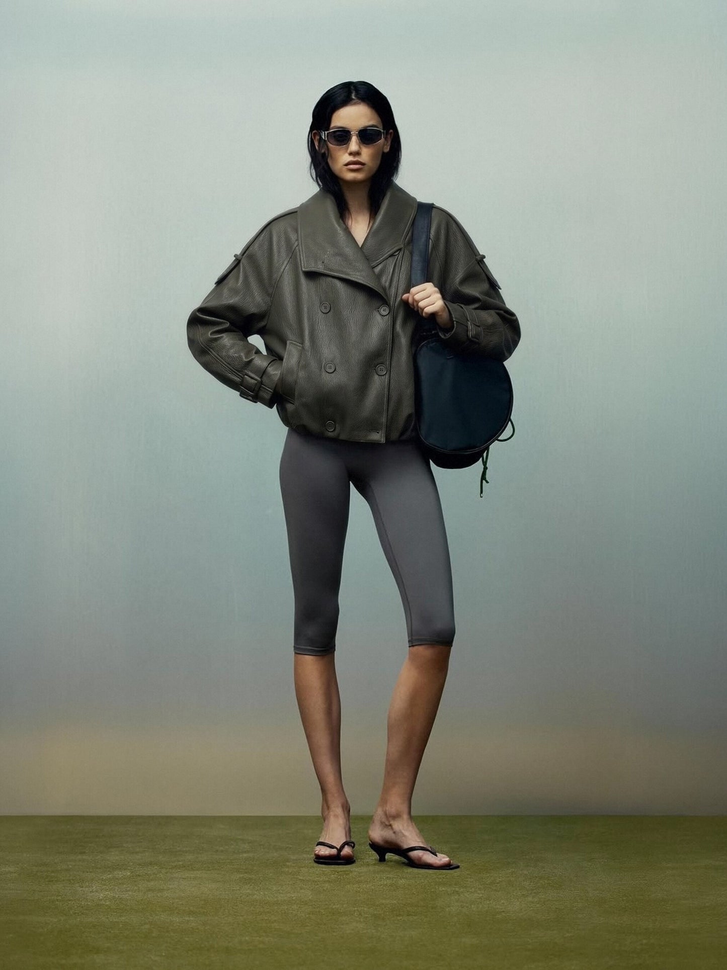 Oversized Black Faux Leather Jacket with Wide Lapels and Buckle Cuffs